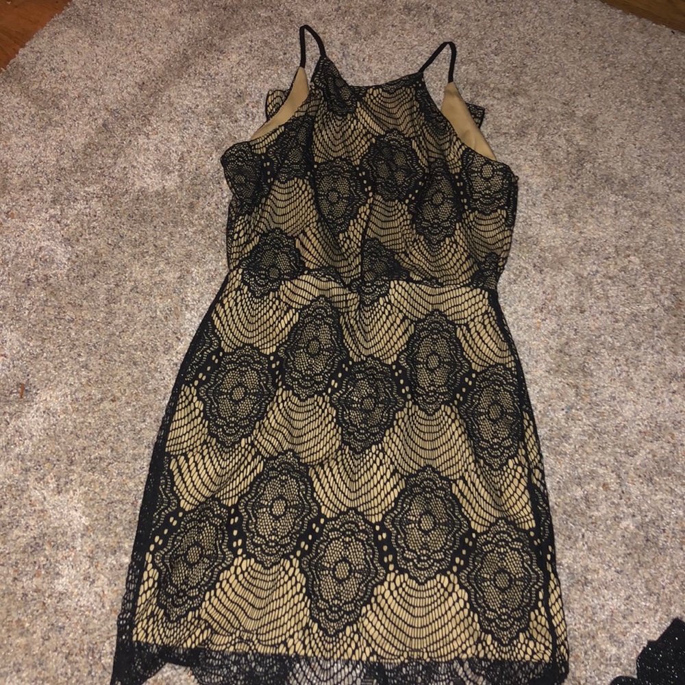 A tan and black Summer dress